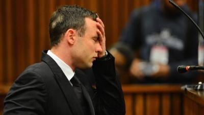 Oscar Pistorius listens to evidence in the Pretoria High Court on June 30, 2014, in Pretoria, South Africa