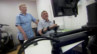 Nurse and stroke patient with robot