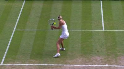 Maria Sharapova executes a lob