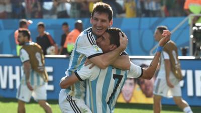 Lionel Messi and Angel Di Maria celebrate after Argentina beat Switzerland