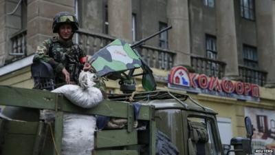 Ukrainian soldier on vehicle in Sloviansk