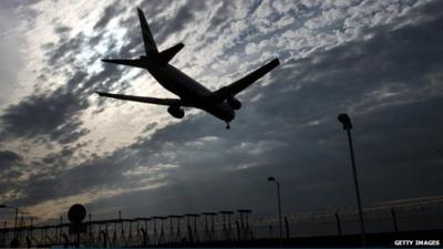 A plane comes into land at Heathrow Airport