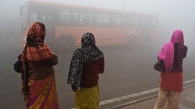 Indian women waiting for bus