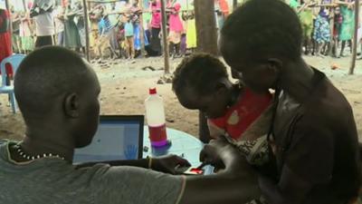 A South Sudanese child is registered at a refugee camp in Ethiopia