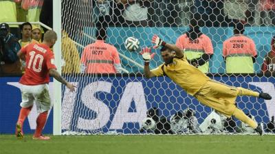 Netherlands' Wesley Sneijder has his penalty saved by Argentina's Sergio Romero