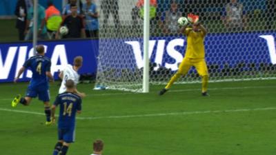 Germany's Andre Schurrle shoots straight at Argentina goalkeeper Romero at the start of extra time in the 2014 World Cup final