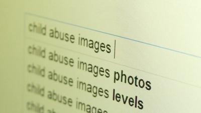 A web page with "child abuse images" in the search field