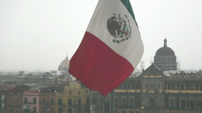 A flag waving over Mexico City