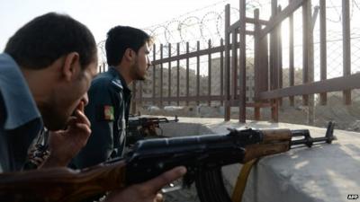 Afghan policemen with guns