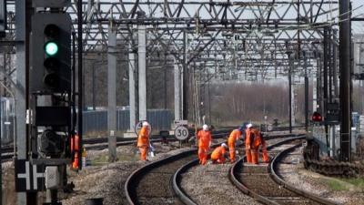 Maintenance men working on a set of points