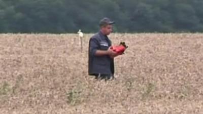 A man carrying the black box