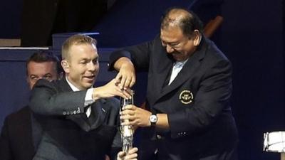 Chris Hoy and Prince Imran wrestle with baton