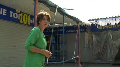 BBC correspondent Natalia Antelava surrounded by empty shops in Donetsk