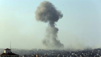 Smoke from an Israeli strike rises in the air over Gaza City, Saturday, July 26, 2014