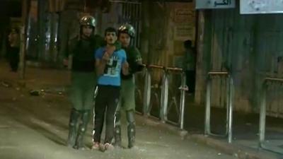 West Bank authorities hold a young man