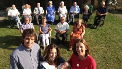 Baby with parents and grandparents