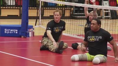 Prince Harry playing sitting volleyball