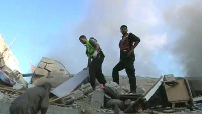 Men amongst rubble in Gaza