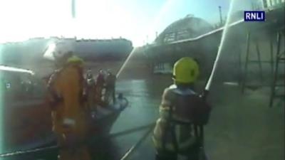 Fire crews battle pier blaze