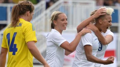 Lianne Sanderson celebrates after scoring for England against Sweden