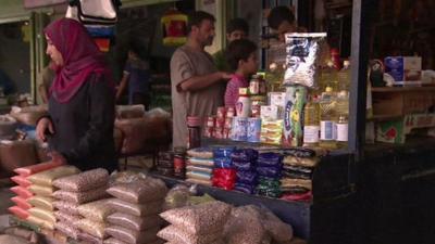 Palestinians shopping in the Gaza Strip on first day of Egyptian brokered truce