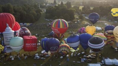 Hot air balloons depart from Aston Court in a mass ascent on the first full day of the Bristol International Balloon Fiesta on August 8, 2014