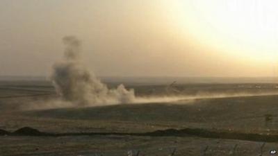 Smoke rising from airstrikes targeting Islamic State militants near the Khazer checkpoint outside of the city of Irbil in northern Iraq, Friday, Aug. 8, 2014.