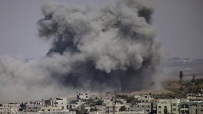 Smoke covers the skyline of Gaza