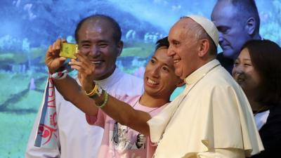 Pope Francis poses for a selfie