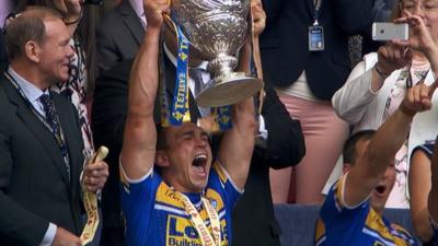 Leeds captain Kevin Sinfield lifts the Challenge Cup trophy