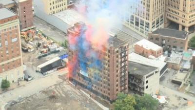 Colourful smoke can be seen from the Wellington Annex building as it is demolished