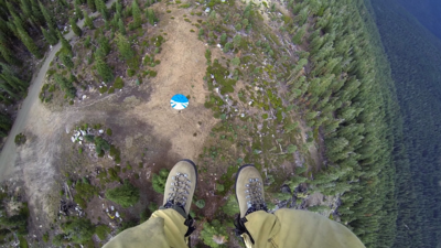 Smokejumper's view as he parachutes into the wilderness