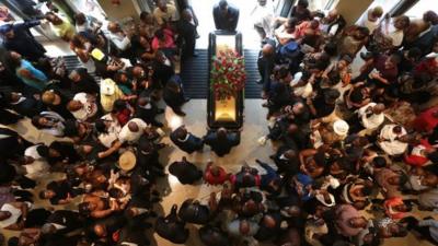 Michael Brown's casket leaves church