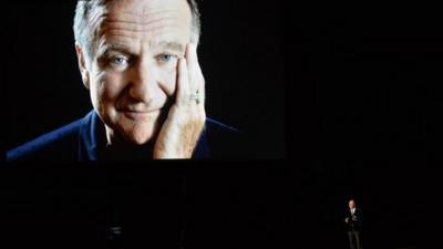 Actor Billy Crystal (R) speaks in tribute to the late Robin Williams onstage at the 66th Annual Primetime Emmy Awards