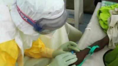 Medic treating an Ebola victim