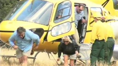 People leaving rescue helicopter