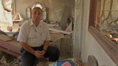 English teacher Abdul Karim Abu Ahmed in his ruined home