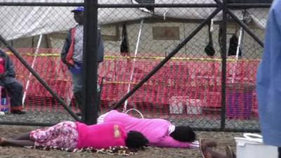 Patients lying outside hospital grounds