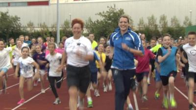 Eilidh Child runs with members of Inverclyde Athletics club