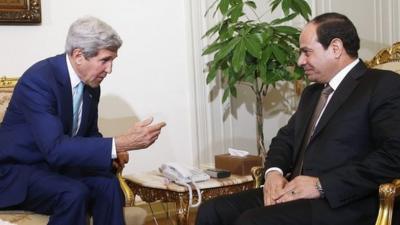 U.S. Secretary of State John Kerry (L) speaks with Egyptian President Abdul Fattah al-Sisi in Cairo