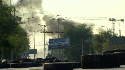 smoke rising over bridge to Donetsk airport