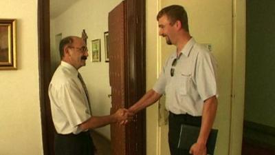 David Haines greeting a colleague