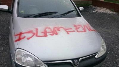 Islamophobic graffiti on a car