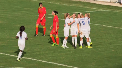 England's women celebrate during their 10-0 victory away in Montenegro.