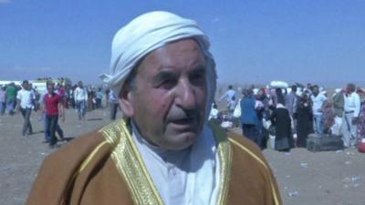 Kurdish refugee on border between Syria and Iraq