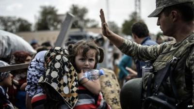 Soldier, child and woman in Mursitpinar