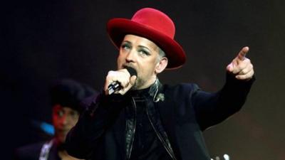 Boy George performing on stage