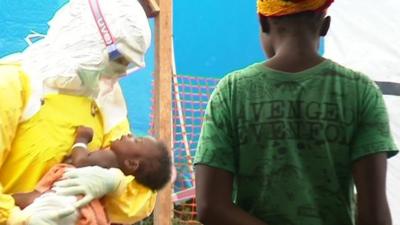 Medical staff holding a baby