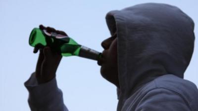 Young person drinking beer