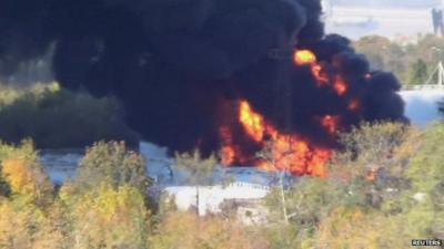 Black smoke billowing from burning refinery near Donetsk airport